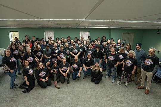 group photo of several people in a room